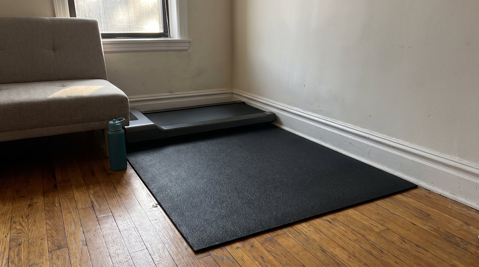 Interlocking EVA foam floor tiles for an apartment home gym corner